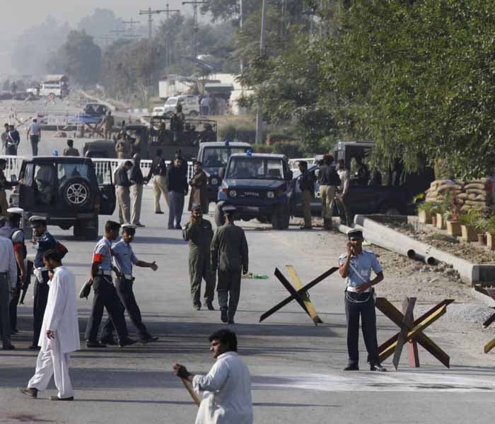 <font size="2">Reports said the bomber walked up to the first check post outside the Pakistan Aeronautical Complex within the cantonment in Kamra in Punjab and detonated his explosives when security guards stopped him. (AP Photo)</font>